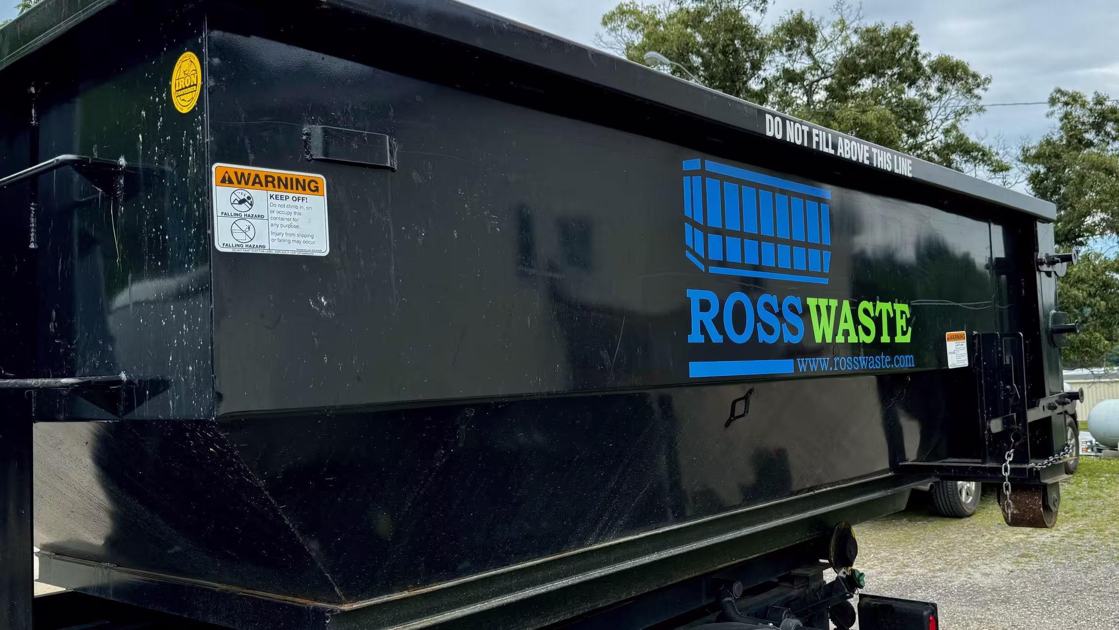 Ross waste Dumpster on back of truck